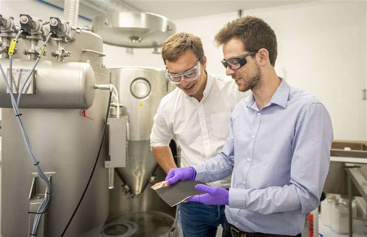 Echion Technologies co-founders Jean de la Verpilliere, CEO, and Alex Groombridge, CTO,chek the quality of their lithium battery upgrade. Picture: Keith Heppell